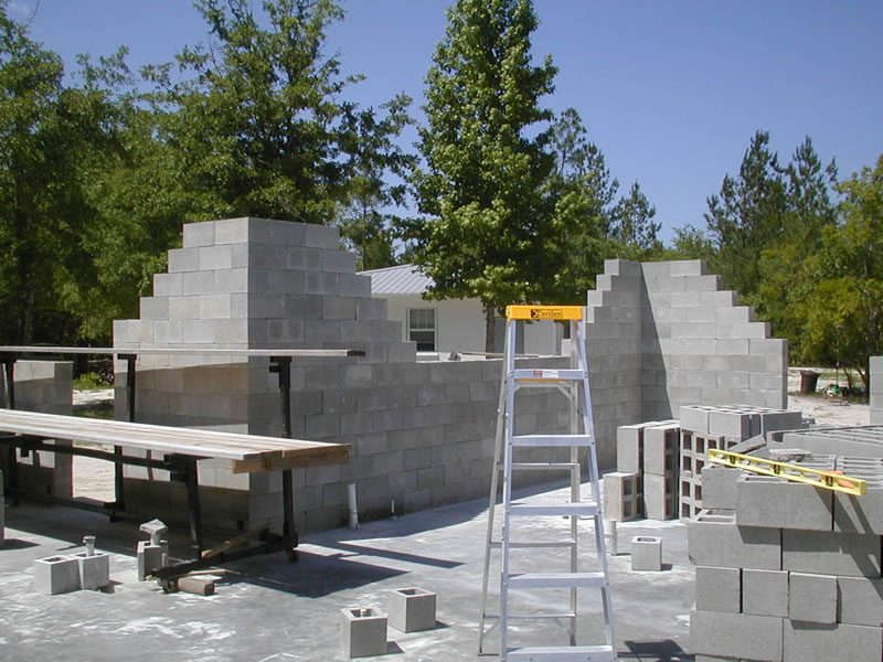 Picture of typical partially stacked dry stacked concrete block wall, block stacking demo.