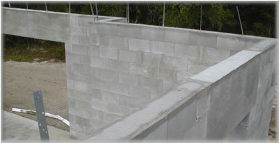 A picture viewiing the top of th walls after the lintel bon beam is filled with concrete.