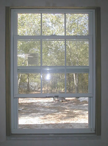 Picture of typical dry stacked block construction mounted window frame.